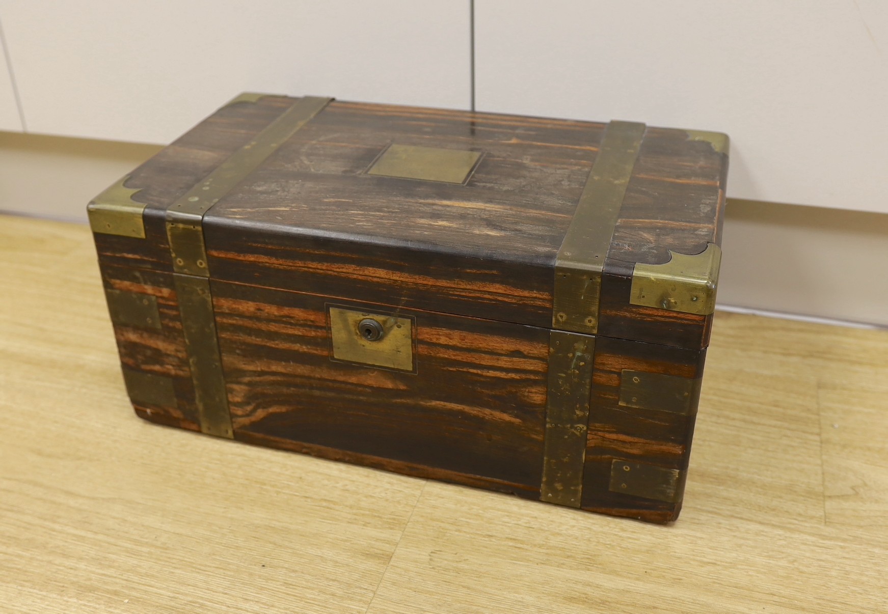 A boxed set of eight Banda carpet bowls, in a Victorian coromandel writing slope (a/f), 35cm wide